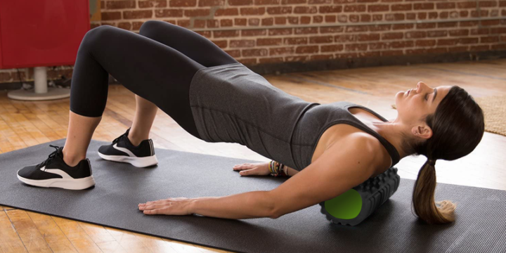 woman foam rolling