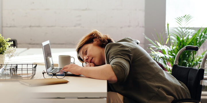 woman sleeping on desk