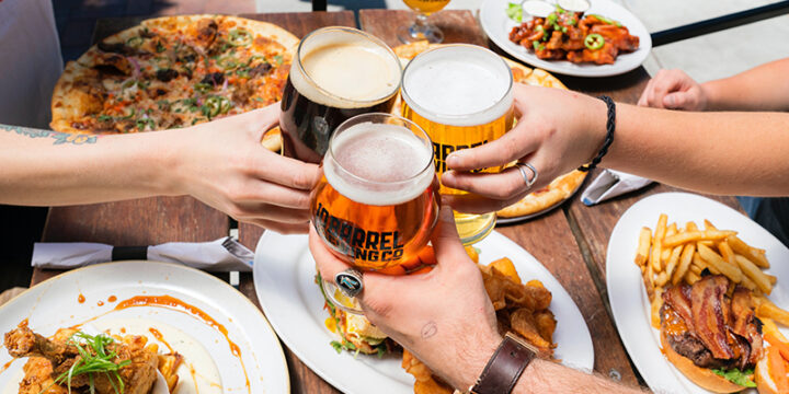 friends enjoying lunch with beer